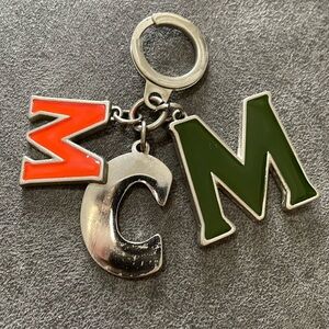 MCM Key Holder with Orange, Silver, and Green Letters